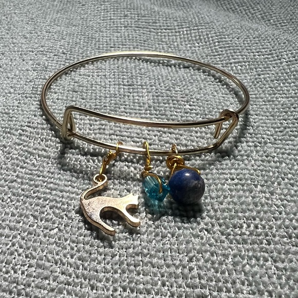 gold metal bracelet with cat, bead, & blue gemstone charms - Picture 1 of 5